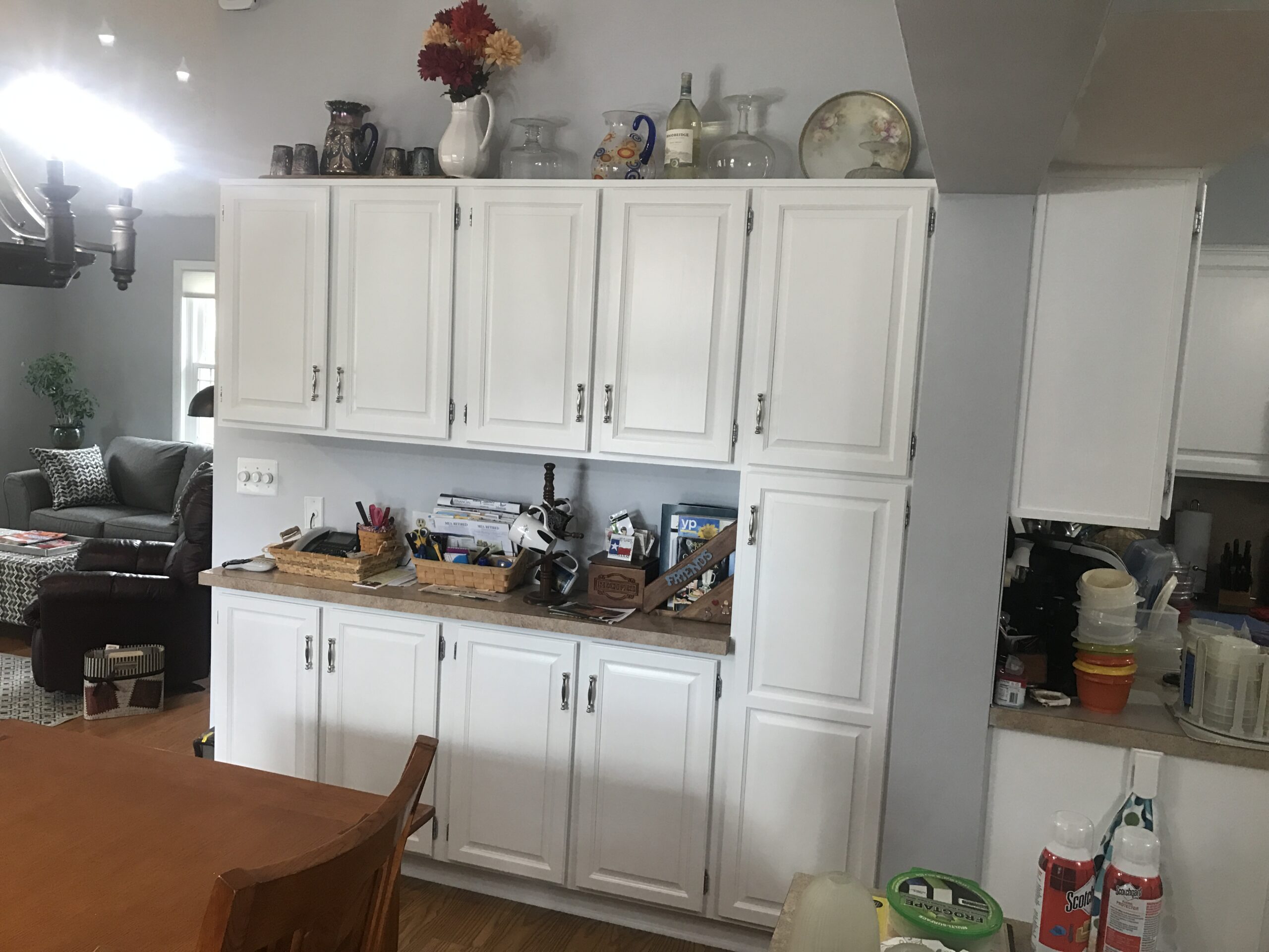 Kitchen with refinished white cabinets