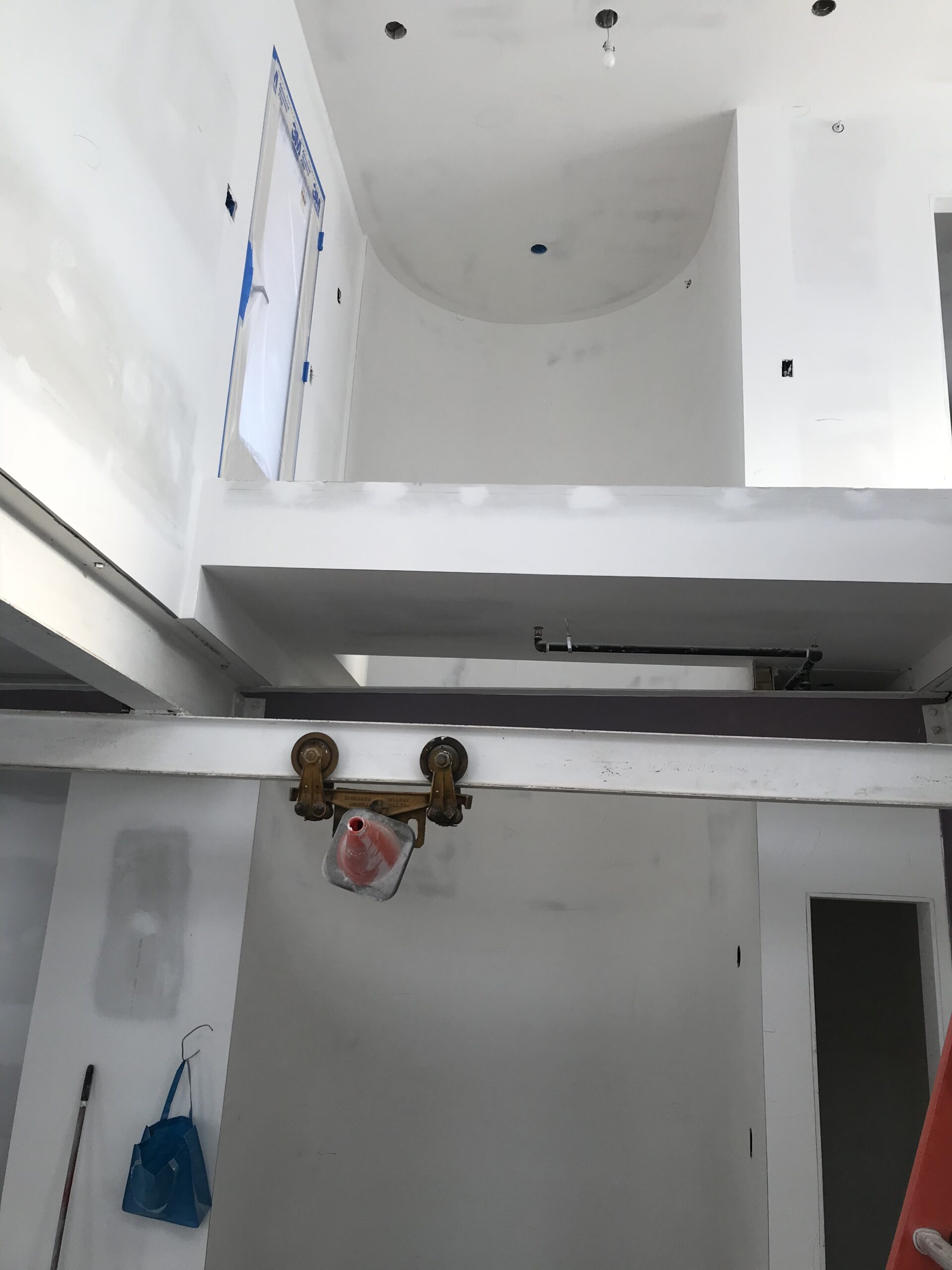 Ceiling and wall drywall patched and prepared before painting